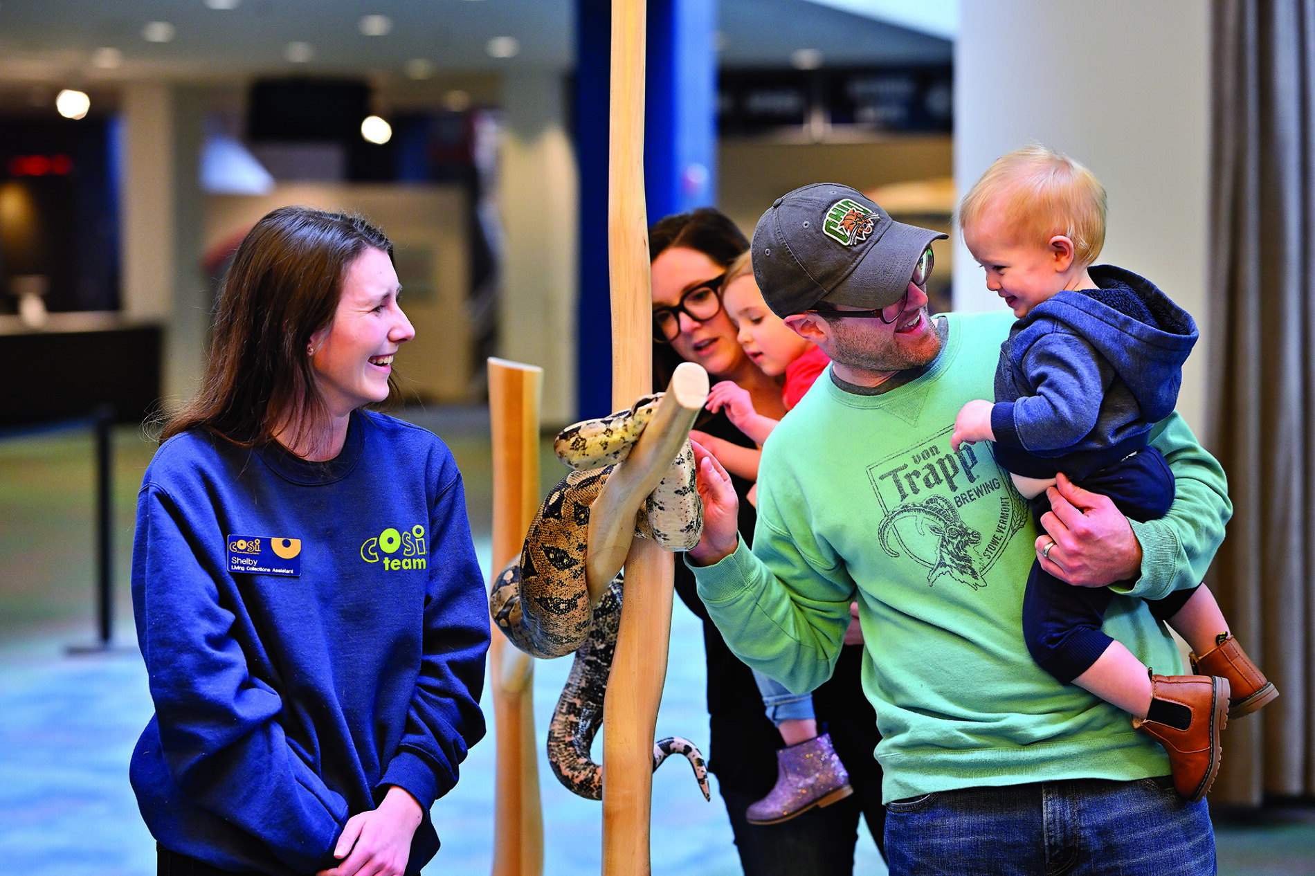 Family petting snake at COSI in Columbus