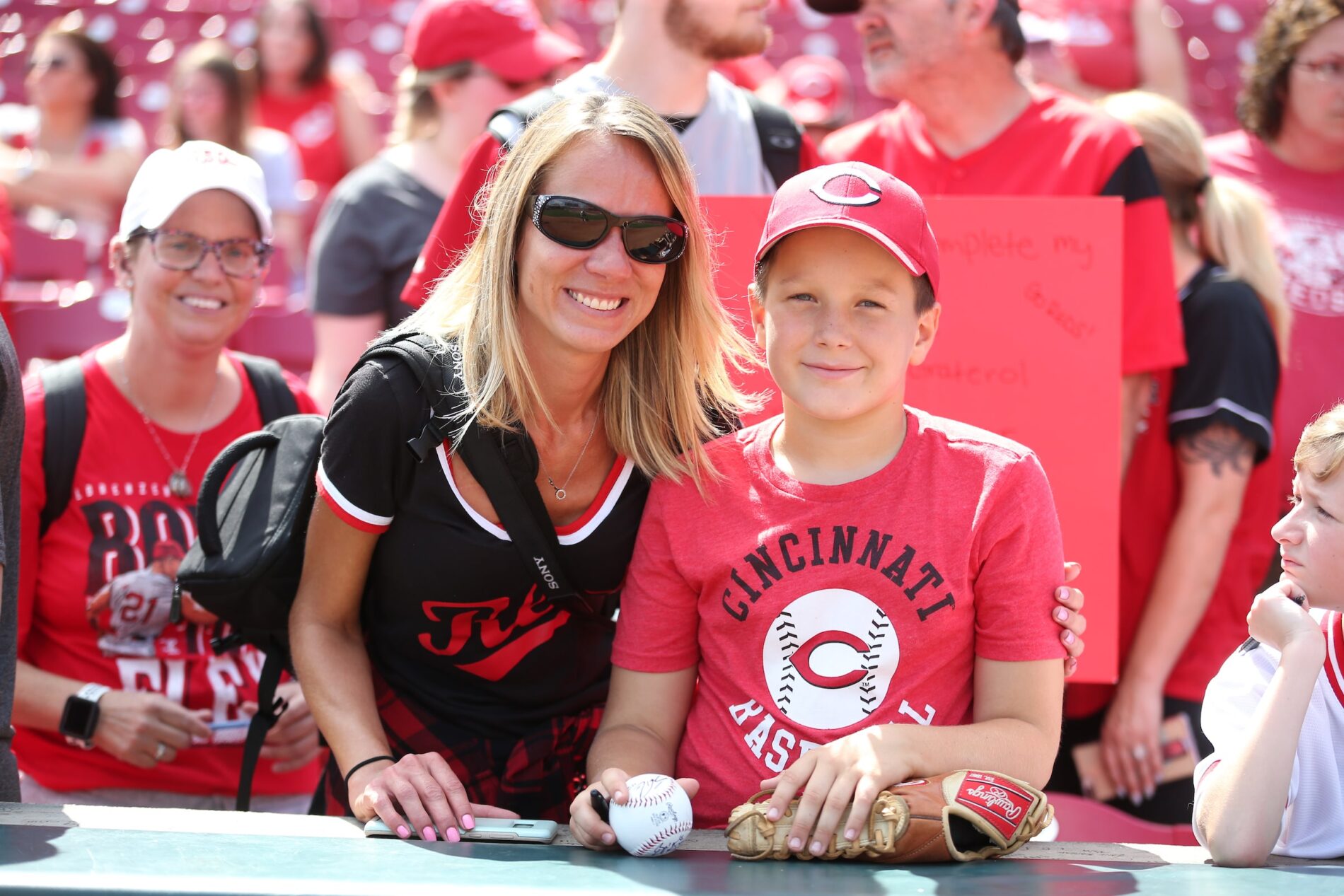 family attending Cincinnati Reds baseball game