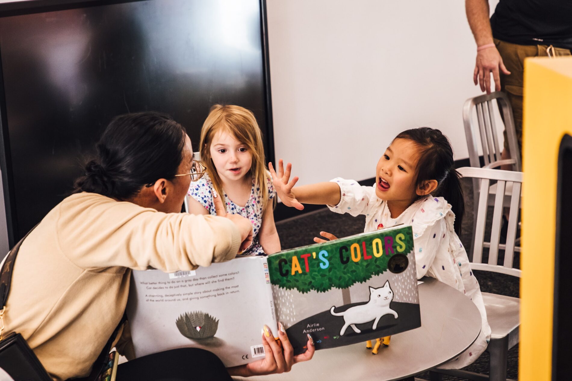 kids reading a book at Columbus Library