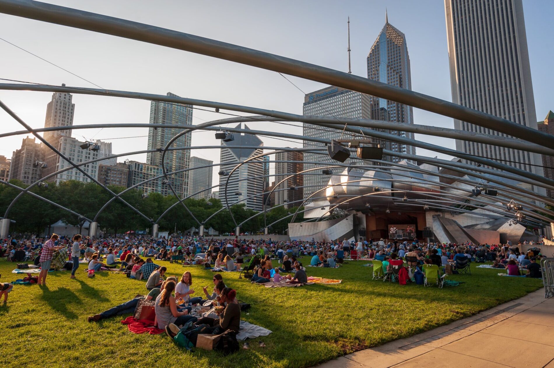 families listening to music at Millennium Park