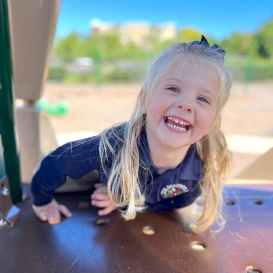 Toddle girl smiling and playing