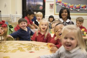 preschool kids sitting around a table