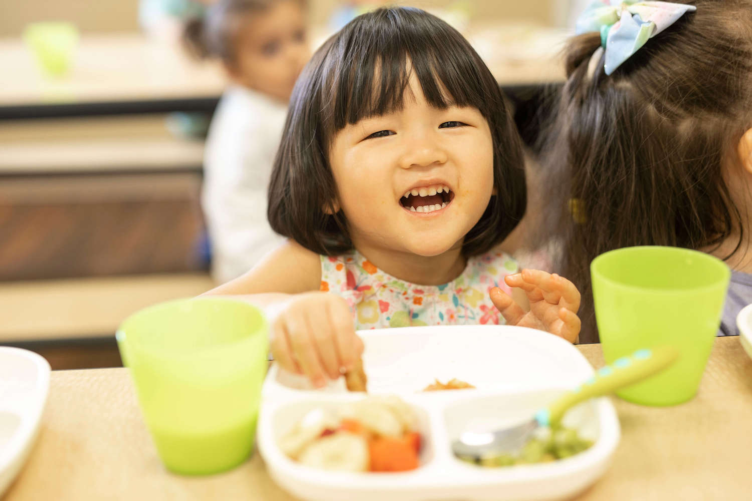 preschool student eating in cafeteria