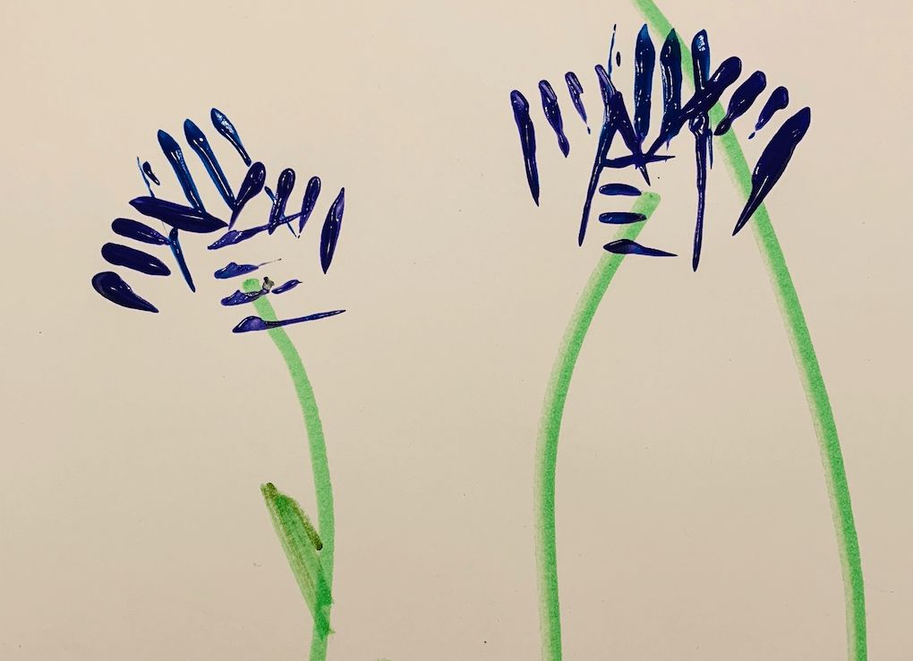 handprint paint art in the shape of flowers