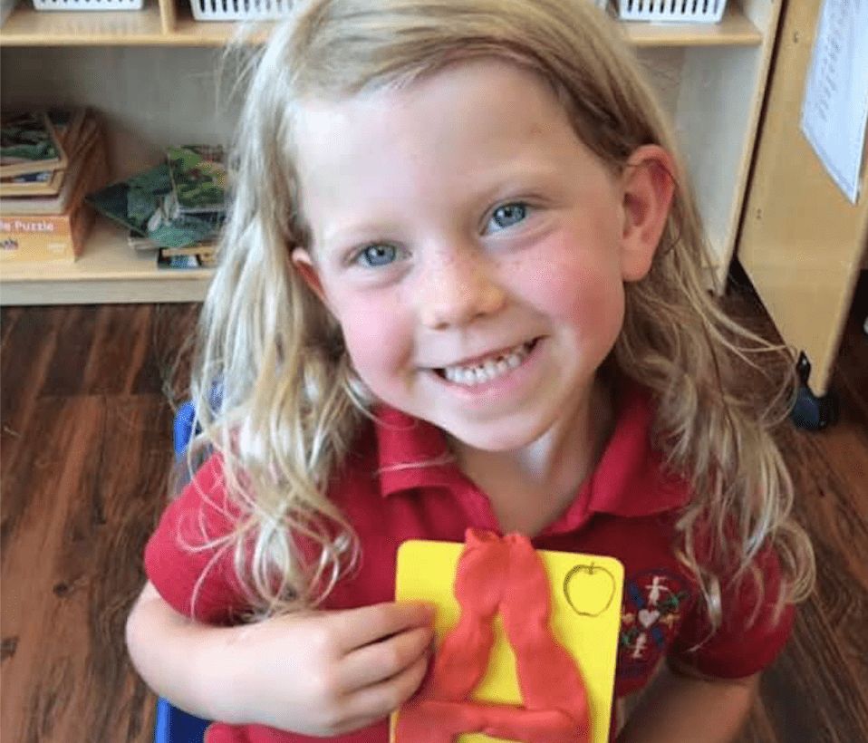 Preschool-Girl-Working-On-Letters-Activity