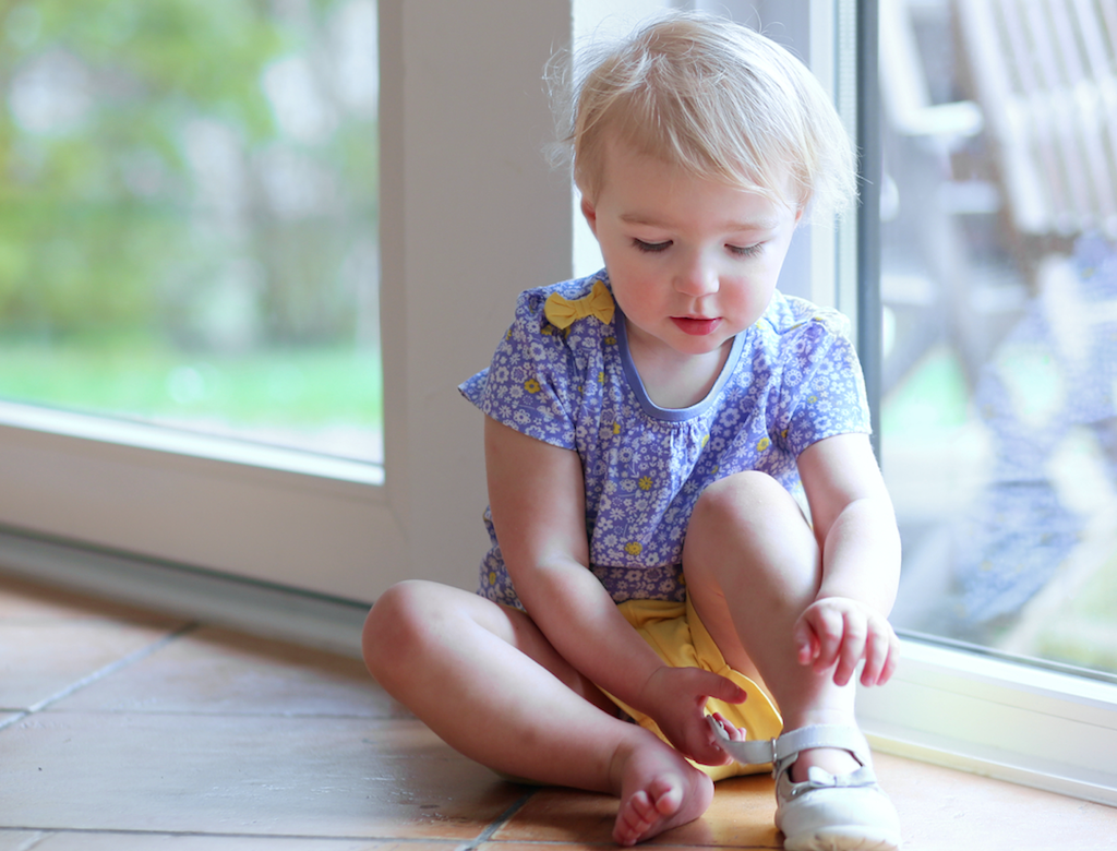 preschool-child-putting-on-shoes