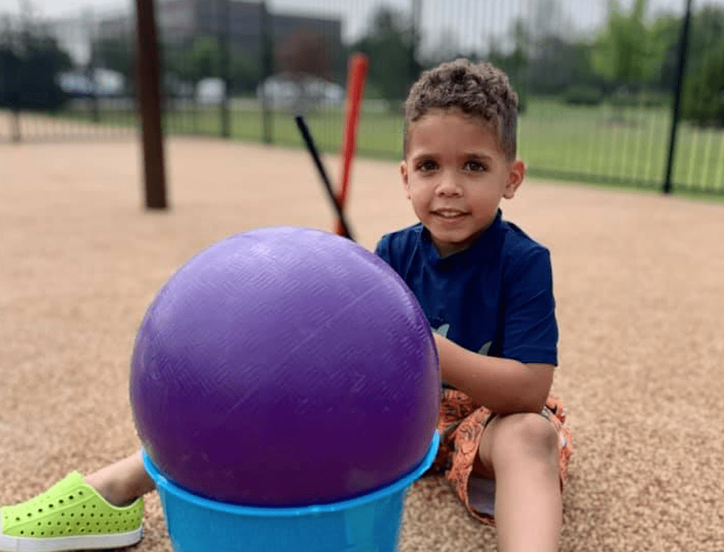 preschool-boy-drumming-on-playground