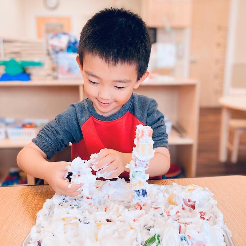 boy playing with food for science