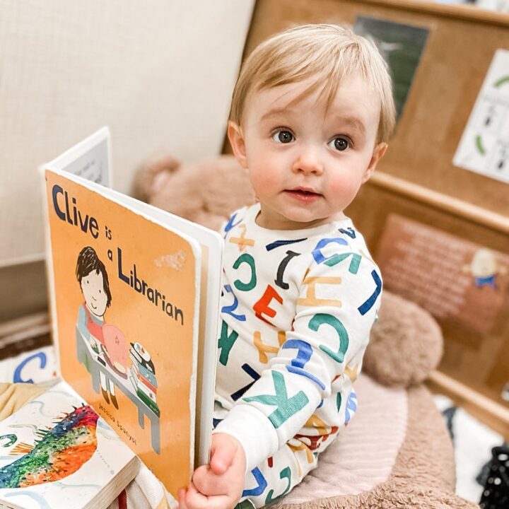 baby looking at book