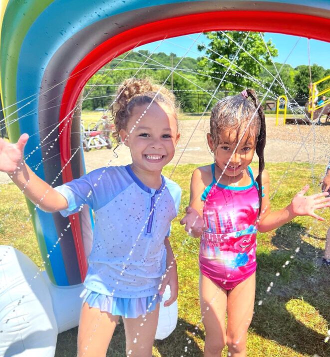 two girls having fun on a water day