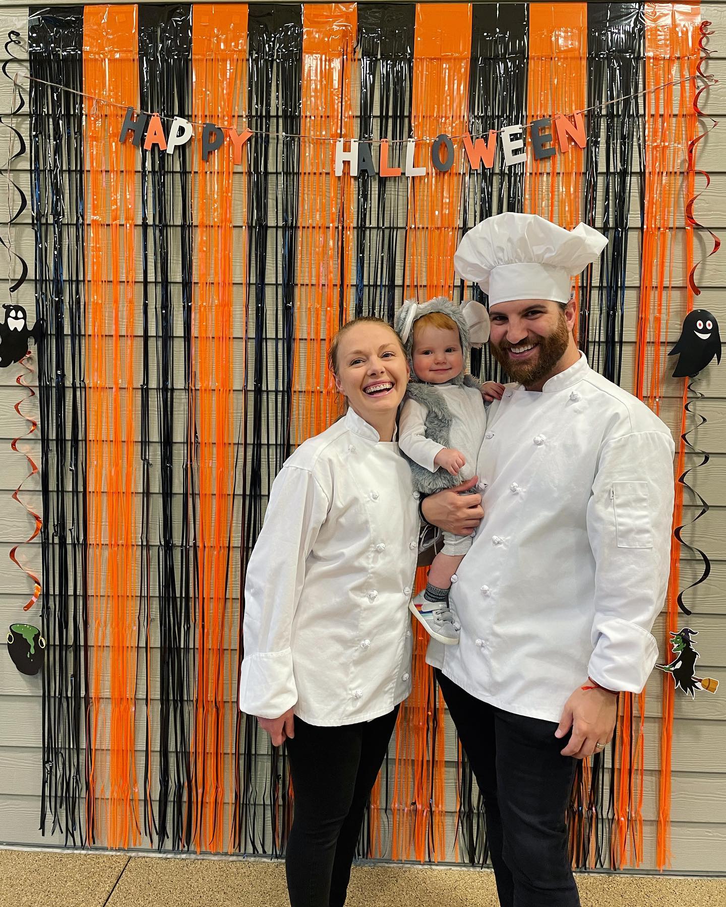 family smiling and laughing in chef costumes