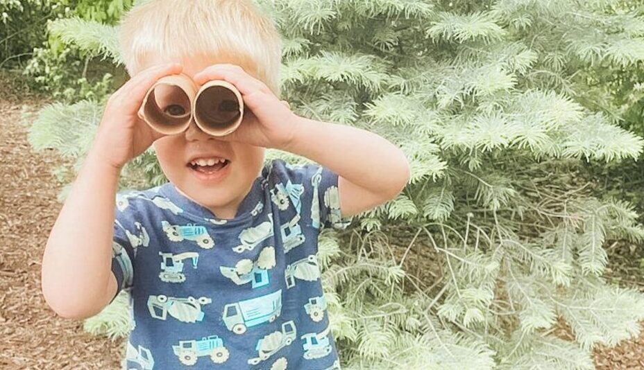 Student at Preschool with Binoculars Outside