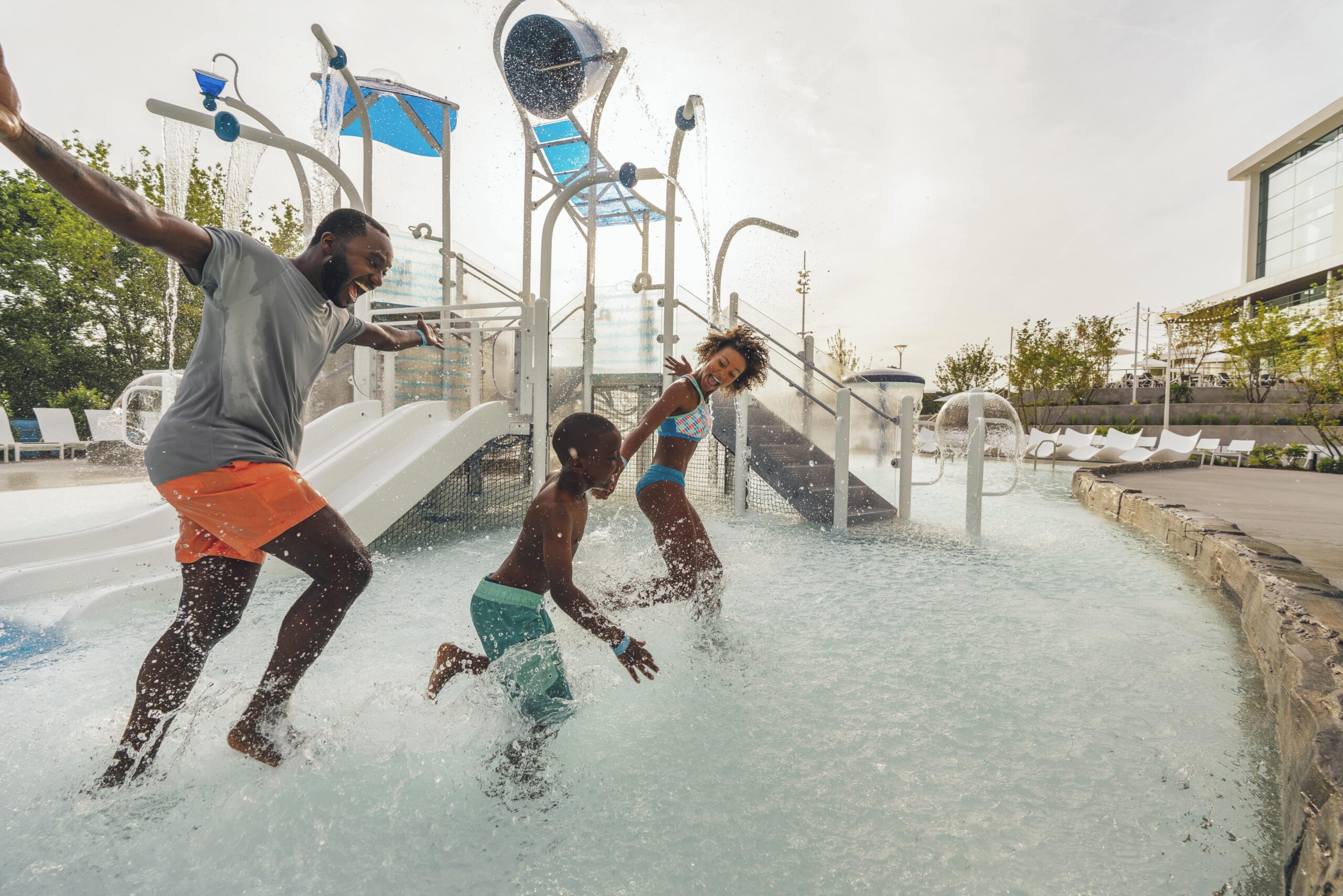 family running through water at Gaylord Opryland Resort