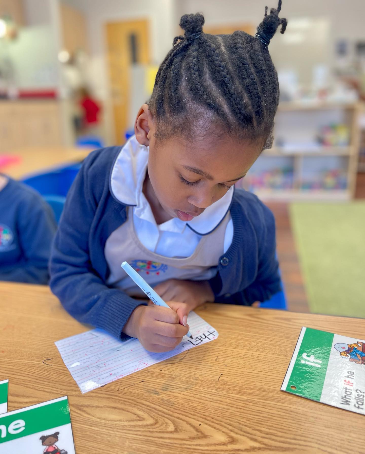 preschooler practicing writing letters