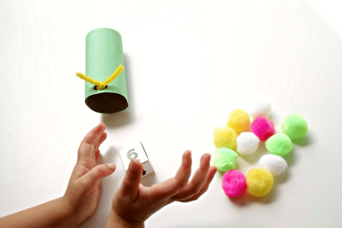 pompoms, dice, and cardboard tube preschool math craft supplies