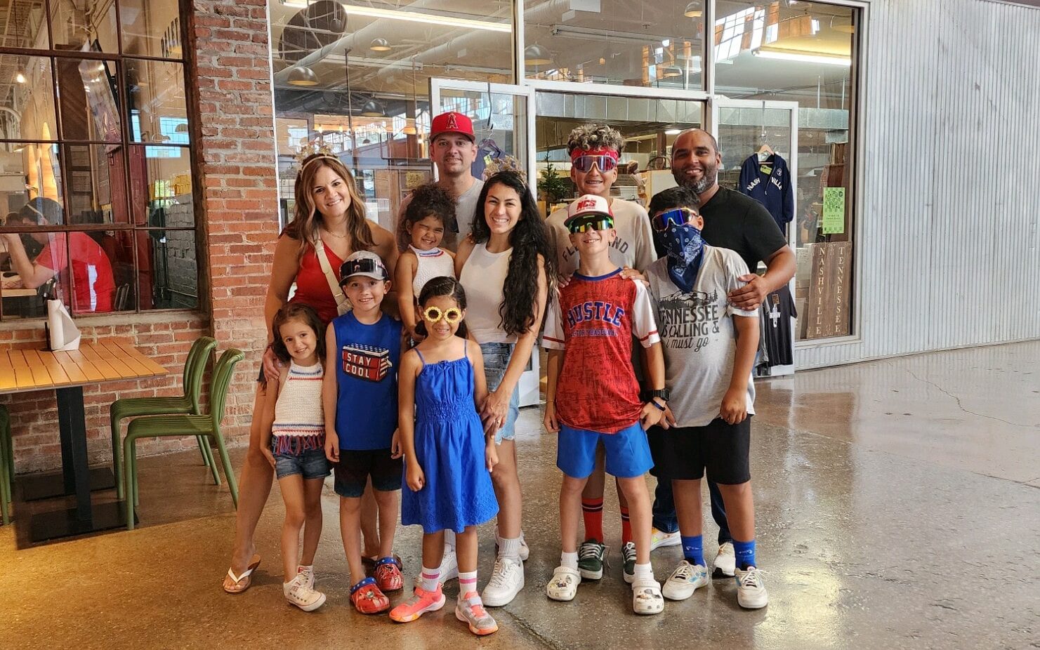 family posing in front of The Factory at Franklin