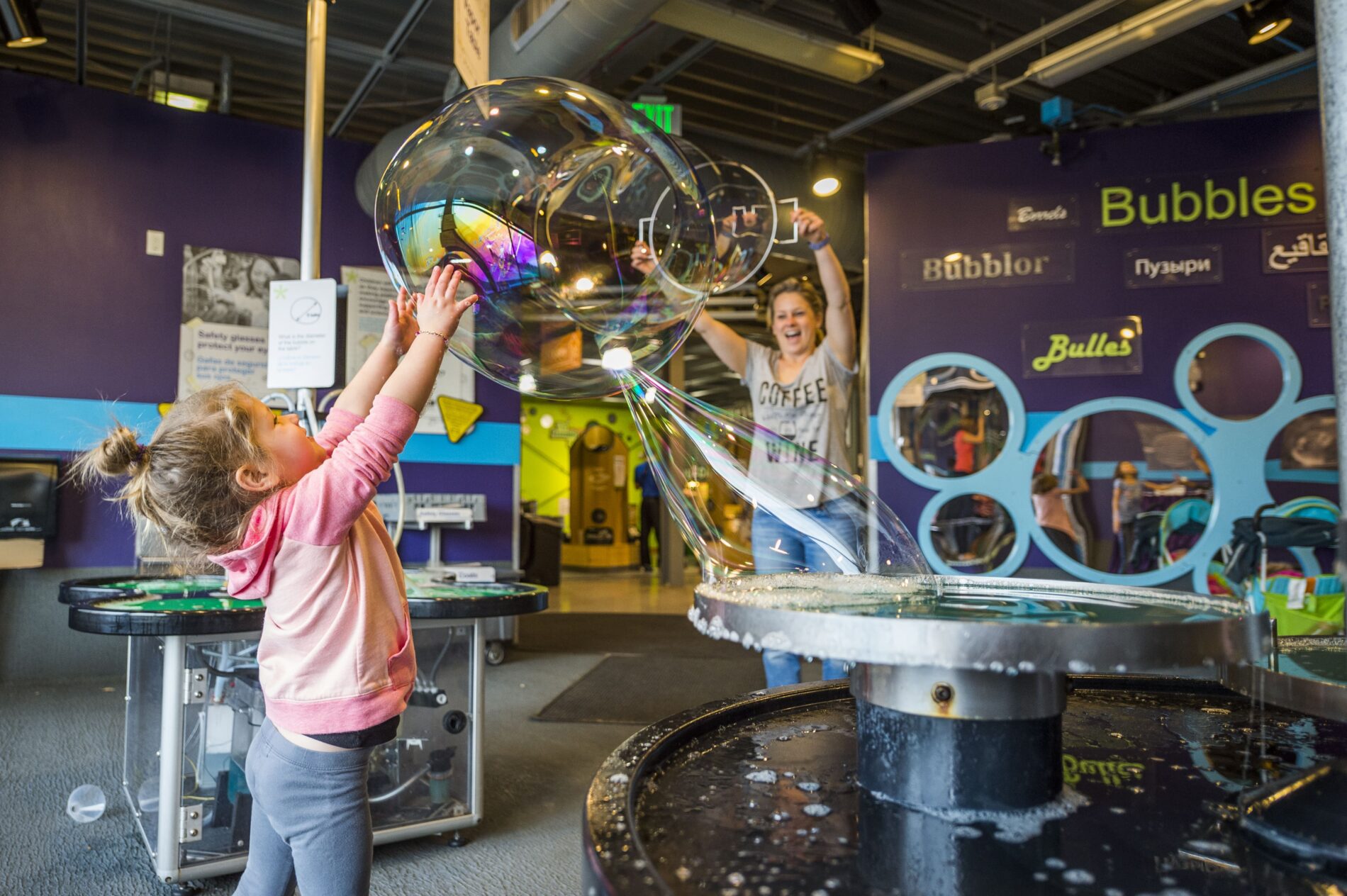 children playing with large bubbles at Children's Museum of Denver