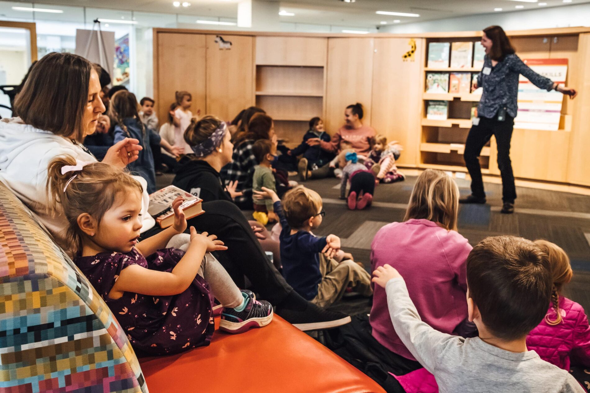 kids and guardians at a program at Columbus Metropolitan Library