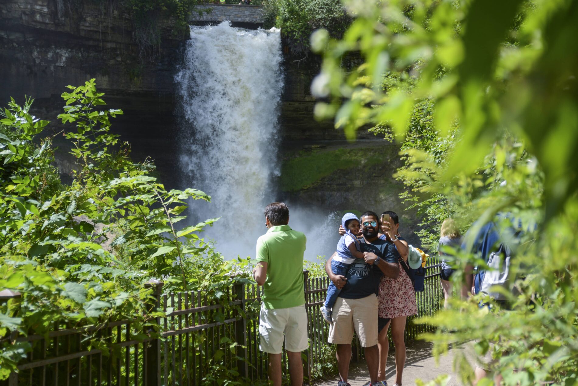 people standing in front of Minnehaha Falls