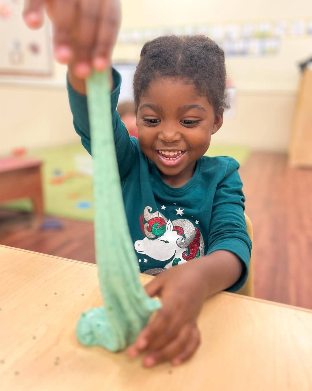 Preschooler making slime for winter experiments