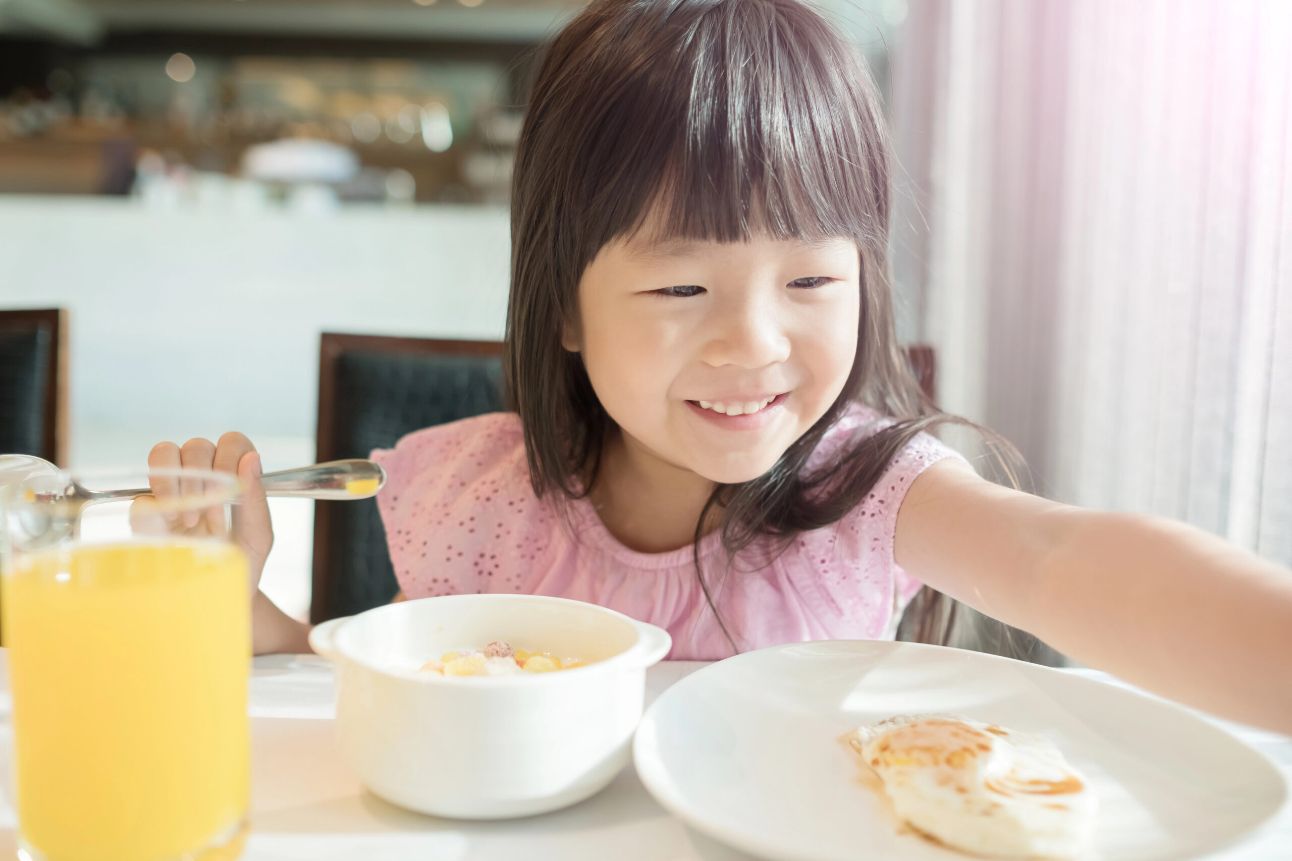 child dining out at restaurant.