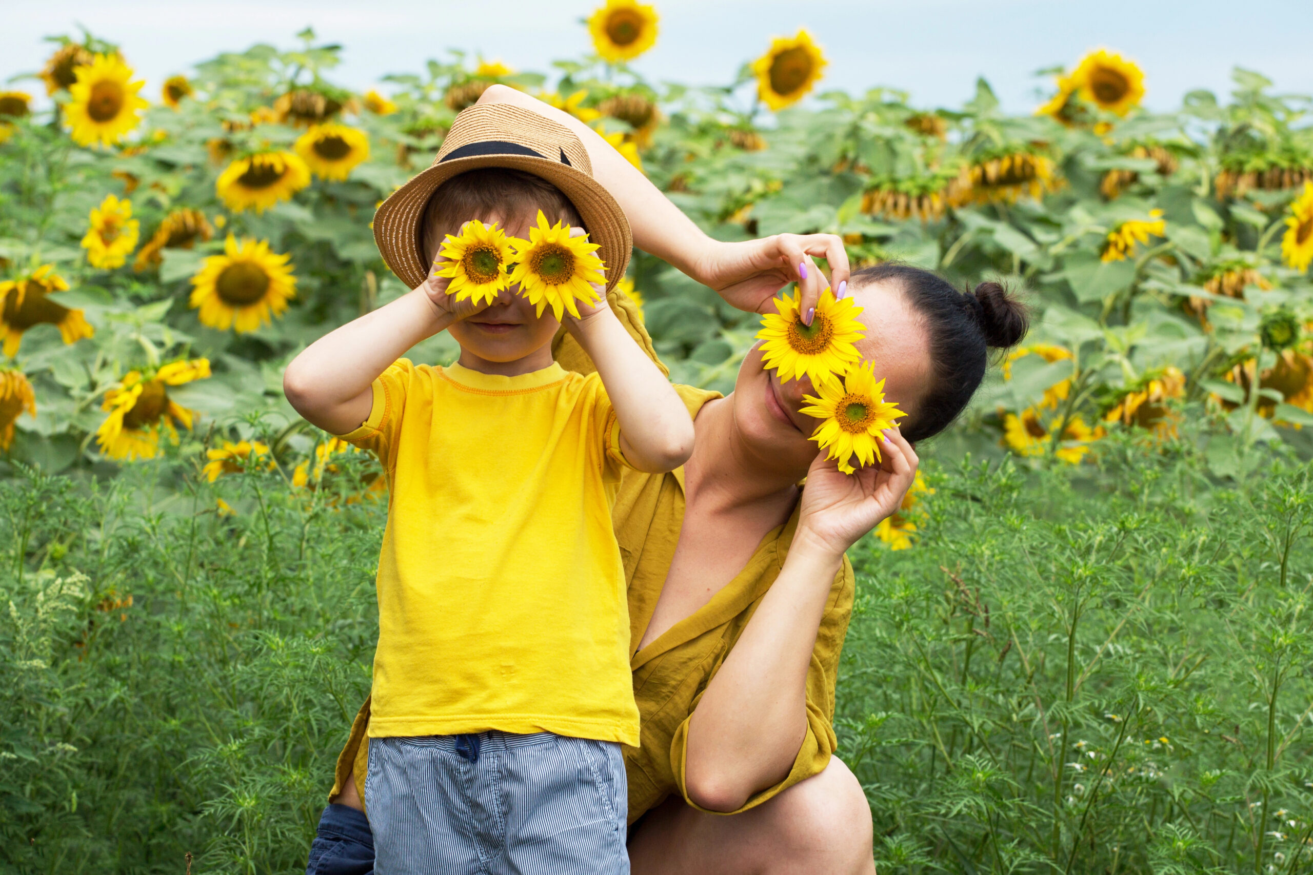 mom and sun in a field of sunflowers