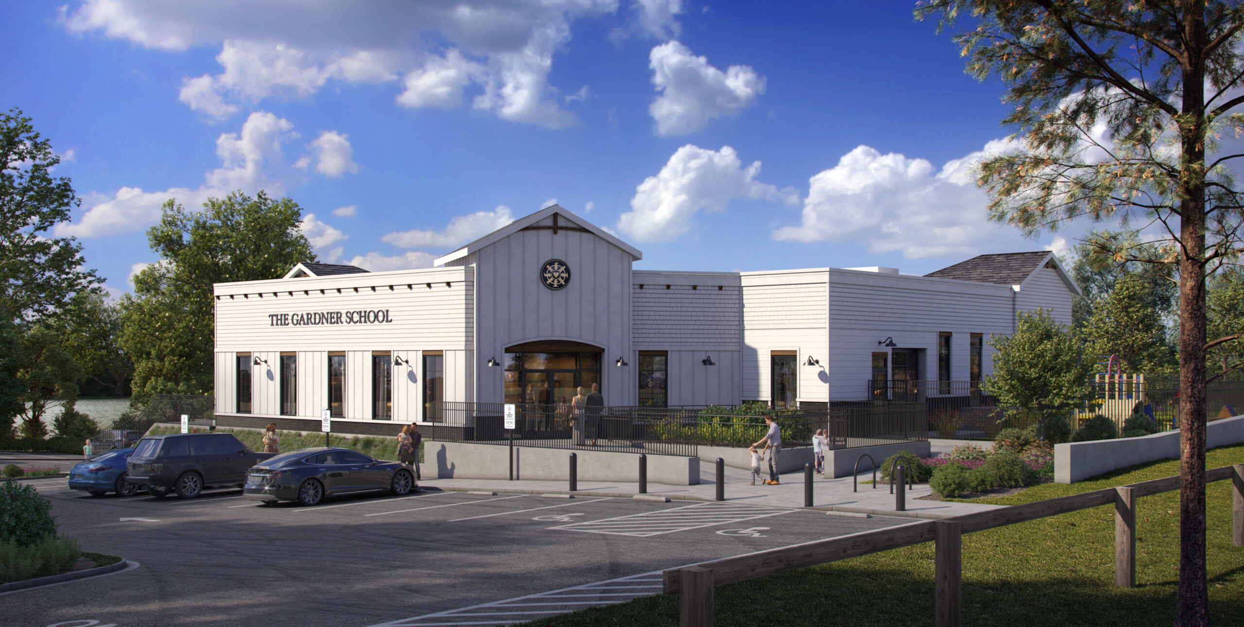 School rendering in front of cloudy blue sky surrounded by grass, trees, and a parking lot