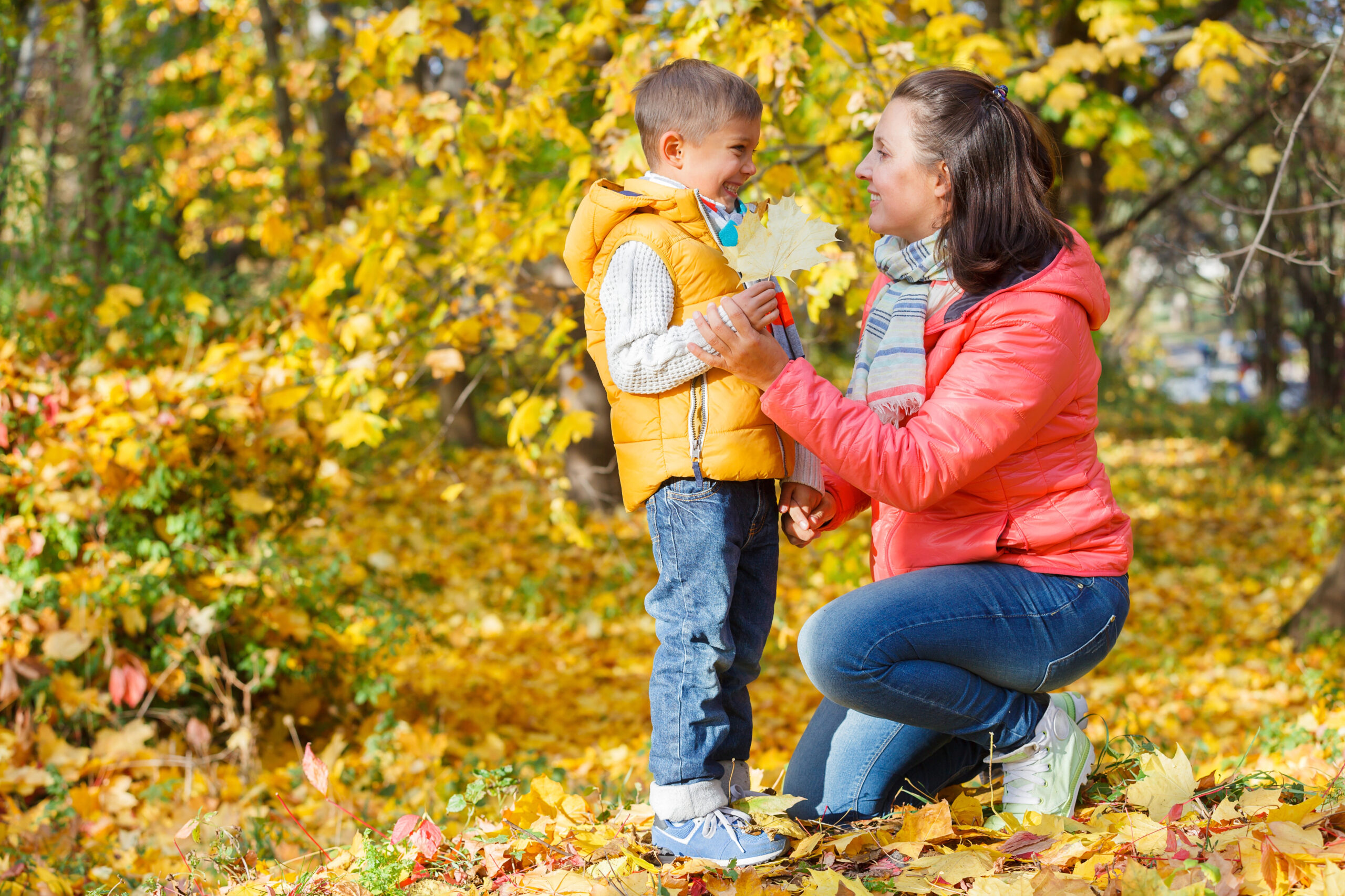 Mom and sun on fall walking trail