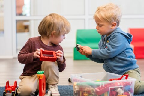 young children playing with blocks
