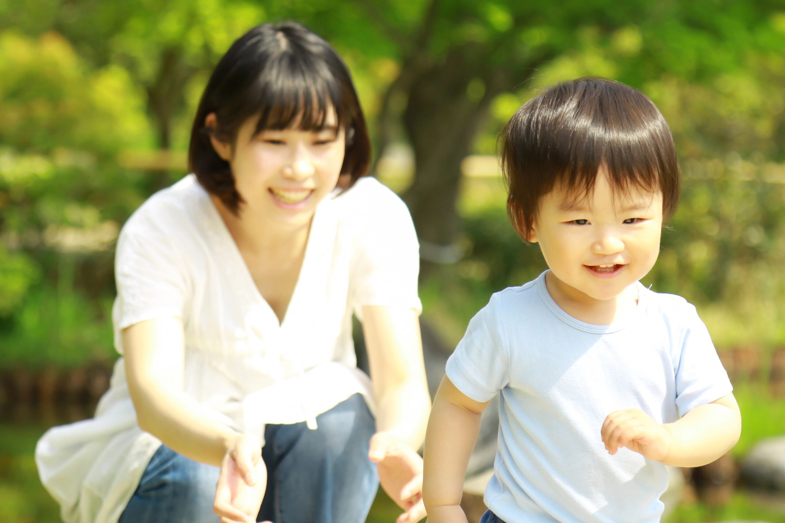 mom and son in park playing