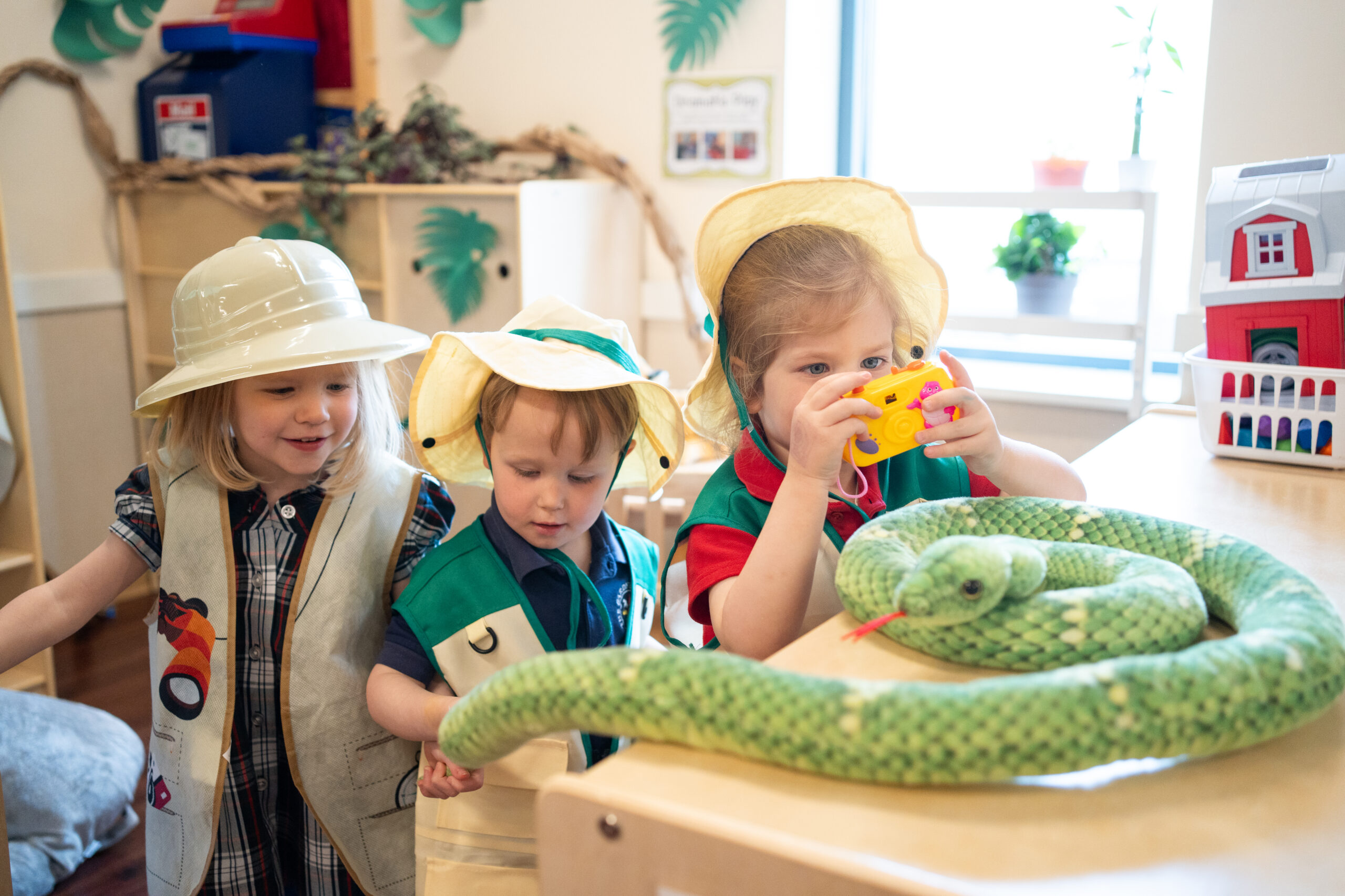 three preschool students pretending to be on a safari